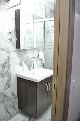 a bathroom with a sink and a mirror at HOTEL GLOBAL 2022 in Istanbul
