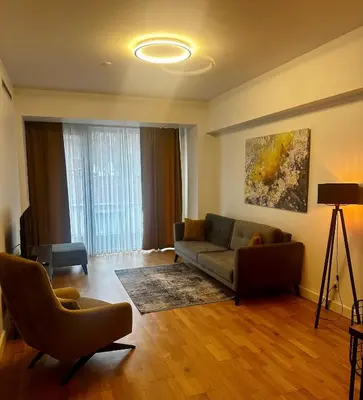 a living room with a couch and two chairs at The Y Istanbul Suites in Istanbul
