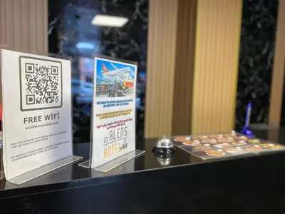 a table with two signs on it with some cupcakes at iNALENS AİRPORT HOTEL in Arnavutköy