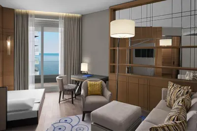 a living room with a couch and a table at JW Marriott Hotel Istanbul Marmara Sea in Istanbul