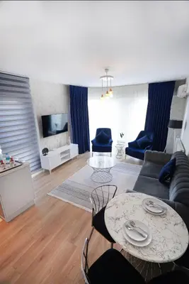 a living room with a couch and a table at King Suite SS7 in Istanbul
