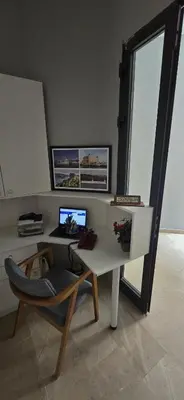 a desk with a computer and a chair in a room at Seven Studıos Sultanahmet in Istanbul