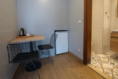a room with a table and a chair and a door at Seven Studıos Sultanahmet in Istanbul