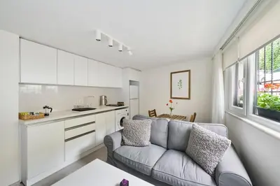 a living room with a couch and a kitchen at Cute Charming 1bed1bath Bebek Hidden Gem! #77 in Istanbul