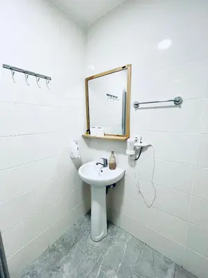 a white bathroom with a sink and a mirror at Puffin Boutique - Istanbul in Istanbul