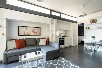 a living room with a couch and a table at Brand New Central Modern Loft Smart Design! #144 in Istanbul