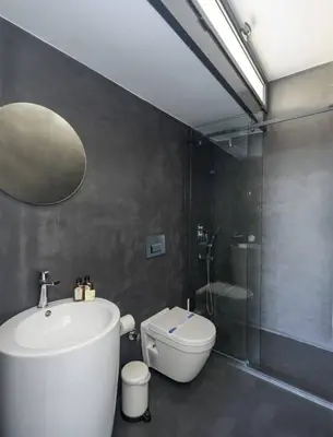 a bathroom with a tub and a toilet and a shower at Brand New Central Modern Loft Smart Design! #144 in Istanbul