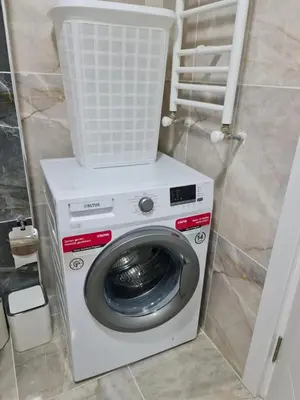 a washing machine with a basket on top of it at King Suite WH32 in Istanbul