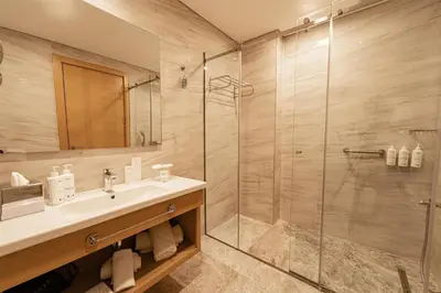 a bathroom with a sink and a shower at Radisson Hotel Istanbul Harbiye in Istanbul