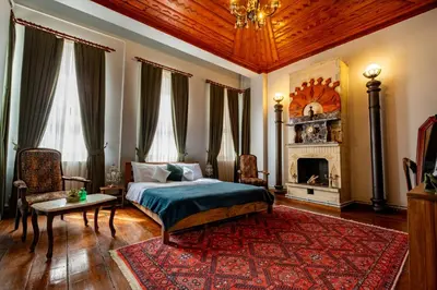 a bedroom with a bed and a fireplace at Nevalist Hotel in Istanbul