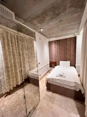 a bedroom with a bed and a glass shower at AB Residences- Private Villa Independent in Istanbul