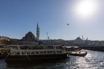 a ferry boat is docked in a river at Sirin Han Hotel Old City in Istanbul