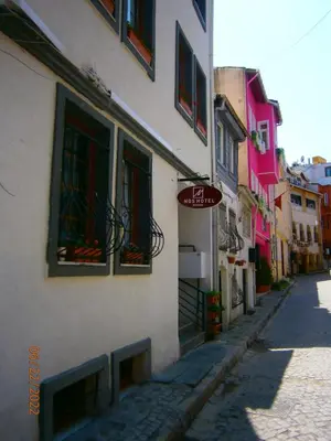 a building with a sign on the side of a street at Nos Istanbul in Istanbul
