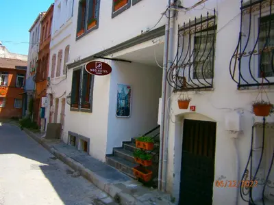 a white building with stairs and a sign on it at Nos Istanbul in Istanbul