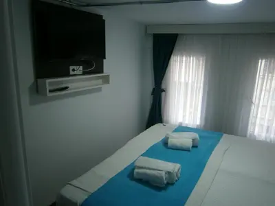 a bedroom with a bed with two towels on it at Nos Istanbul in Istanbul