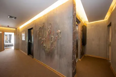 a hallway with a large painting on the wall at Continental Airport Hotel in Istanbul