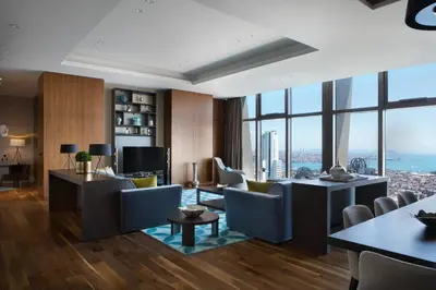 a living room with a view of the city at Istanbul Marriott Hotel Sisli in Istanbul