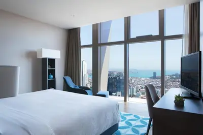 a hotel room with a bed and a large window at Istanbul Marriott Hotel Sisli in Istanbul