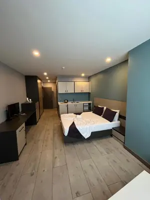 a bedroom with a large bed in a room at Agora Royal Residence in Esenyurt