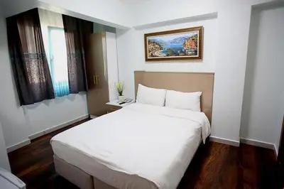 a bedroom with a large white bed in a room at Metrolux Hotel in Istanbul