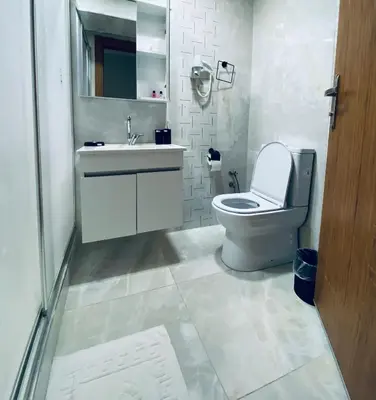 a bathroom with a toilet and a sink at HOTEL ÖZSEFA in Istanbul