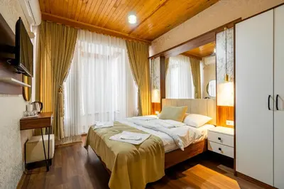 a bedroom with a bed and a large window at Candy Boutıque in Istanbul