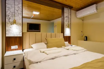 a bedroom with a large bed with white sheets at Candy Boutıque in Istanbul