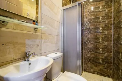 a bathroom with a toilet and a sink and a shower at Candy Boutıque in Istanbul