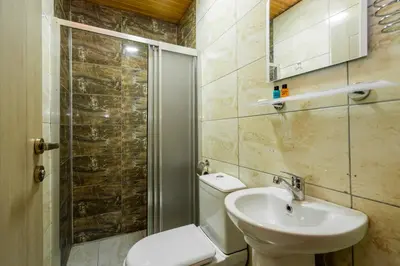a bathroom with a toilet and a sink and a shower at Candy Boutıque in Istanbul