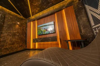 a room with a picture on a wall with a couch at MQ Hotel Suites & SPA in Arnavutköy