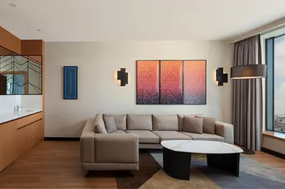 a living room with a couch and a table at Sheraton Istanbul Esenyurt in Istanbul