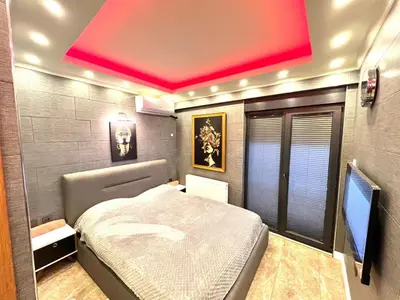 a bedroom with a bed and a red ceiling at LEVENT PALACE REZİDANS in Istanbul