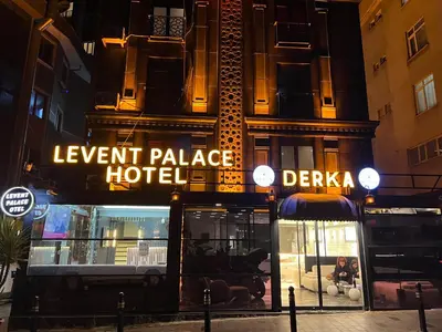 a building with a luxury palace hotel at night at LEVENT PALACE REZİDANS in Istanbul