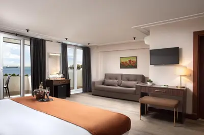 a hotel room with a bed and a couch at Recital Park Hotel in Istanbul