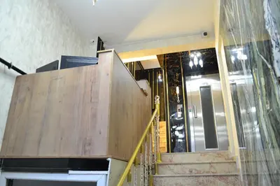 a staircase leading up to a building with a wooden door at Bona Sera Hotel in Istanbul
