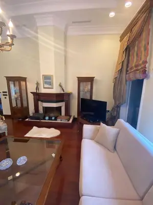 a living room with a white couch and a glass table at Silivri Gazitepe'de 3 katlı, havuzlu lüks villa in Silivri