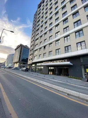 an empty street in front of a large building at Luxury Central Fully Equipped 3BR 2BA Apartment by Siena Suites in Istanbul