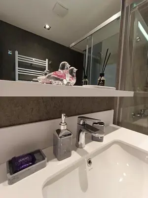 a bathroom sink with a faucet and a mirror at Luxury Fully Equipped 3BR 2BA Apartment by Siena Suites in Istanbul