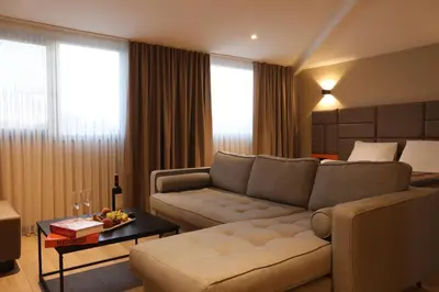 a living room with a couch and a table at İncipark Hotel in Sakarya