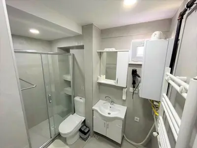 a bathroom with a shower and a toilet and a sink at Kuzguncuk View in Istanbul