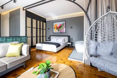 a living room with a bed and a swing at Upside Apartments in Istanbul