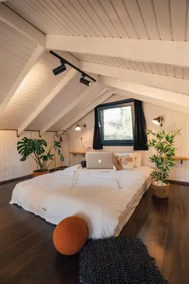 a bedroom with a large bed with a laptop on it at Lemoon House Sapanca in Sapanca