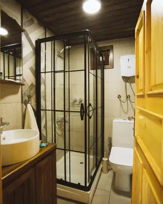 a bathroom with a shower and a sink and a toilet at Sapanca Casamia Suit in Sapanca