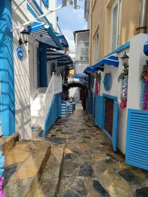 a street in positano with blue and white buildings at MAVİ PALAS HOTEL in Buyukada