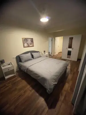 a bedroom with a large bed in a room at Sultan Villa, Merkez Mahallesi Dogu Sirti Caddesi Sultan Sitesi H-2 in Kadıköy