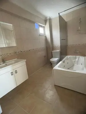 a bathroom with a tub and a toilet and a sink at Sultan Villa, Merkez Mahallesi Dogu Sirti Caddesi Sultan Sitesi H-2 in Kadıköy