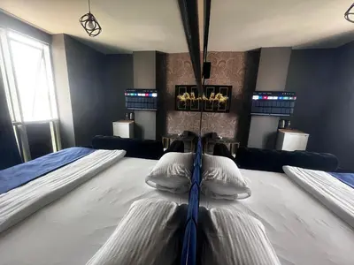 a bedroom with a large bed with two pillows at 216 Hill Suites in Istanbul