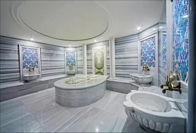 a bathroom with a tub and two sinks in it at Dosso Dossi Hotels Old City in Istanbul