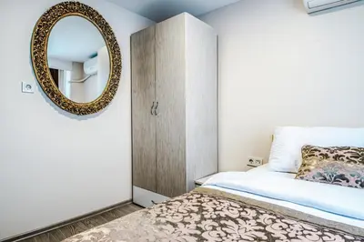 a bedroom with a mirror and a bed at Lazz City Hotel in Istanbul