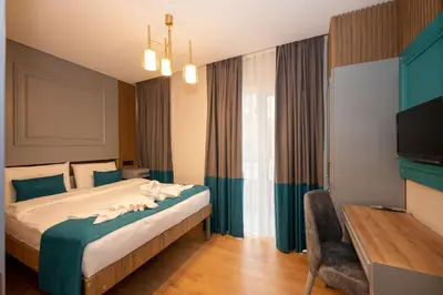 a hotel room with a bed and a television at Lynda Hotel in Istanbul